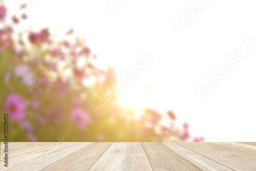 Empty top wooden table on cosmos flowers blooming on blue sky