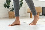 Cropped Shot Of Male Bare Feet Standing On Floor Indoor