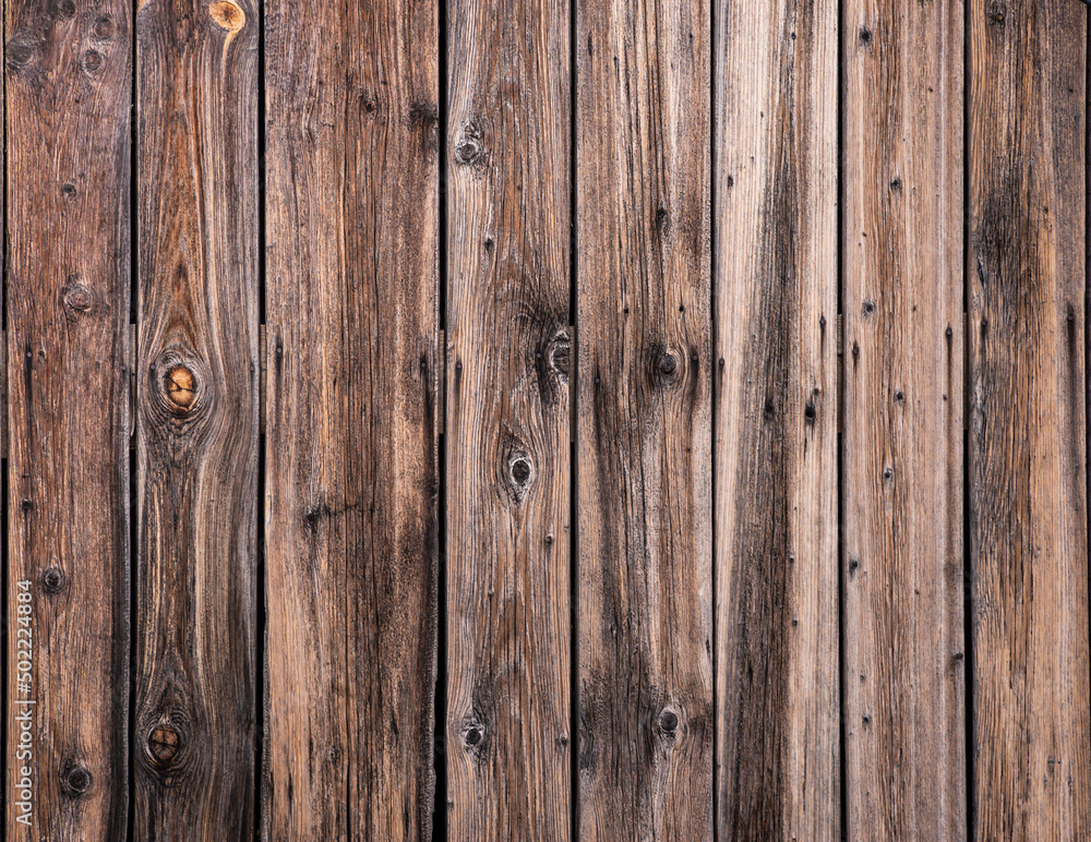 Fototapeta premium Brown natural wood dark background, vintage, with knots and nail holes, wood planks, old painted blue