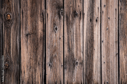 Brown natural wood dark background, vintage, with knots and nail holes, wood planks, old painted blue