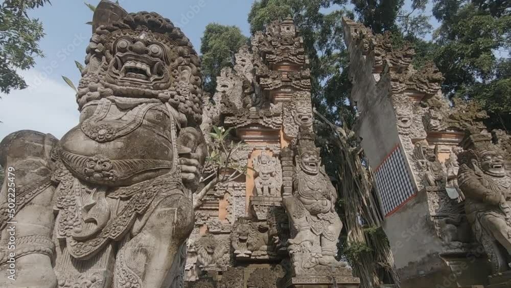 stone carving of gods guarding an entrance to a temple on Bali stone carving of gods guarding an entrance to a temple on Bali