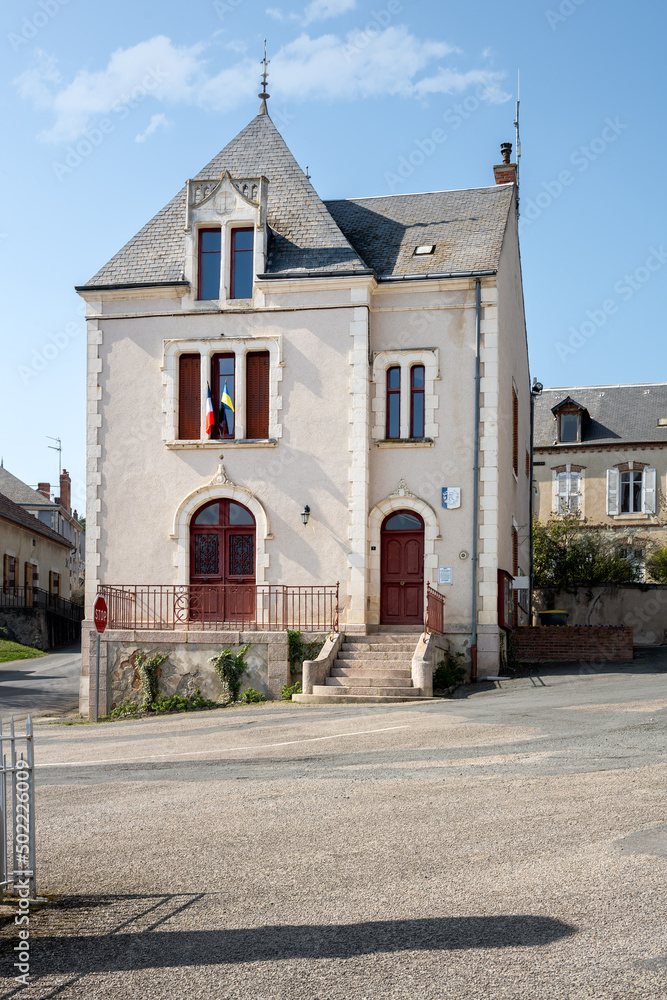 Fototapeta premium Village hall of La Chapelaude with the French and Ukrainian flags, Allier, France
