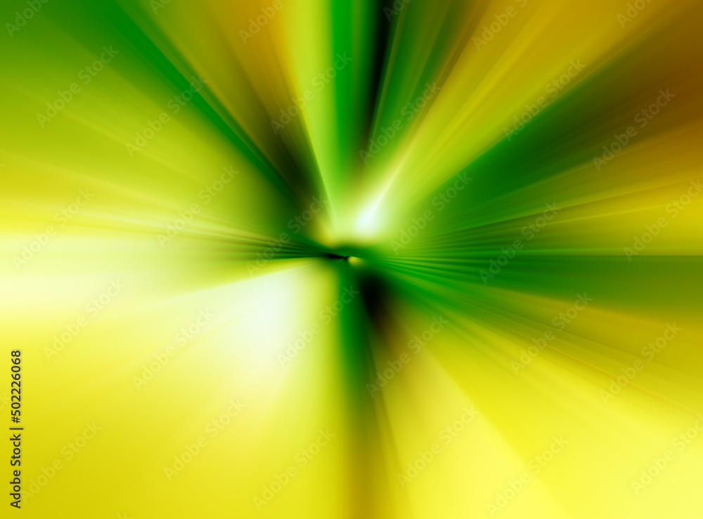 Abstract radial zoom blur surface in yellow and green tones. Blurred green and yellow background with radial, radiating, converging lines.  