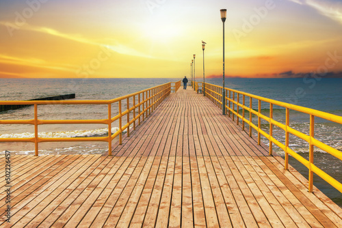 Fototapeta Naklejka Na Ścianę i Meble -  The seaside pier at sunset