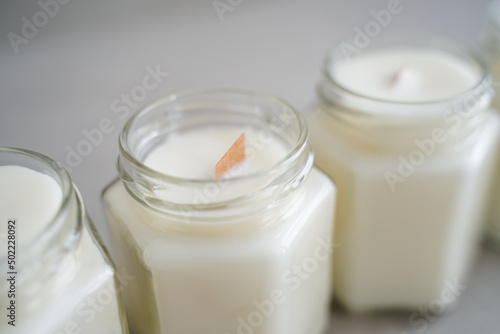 Candles made of natural soy wax in glass jars. Candles with wooden crackling wicks. Scented candles.