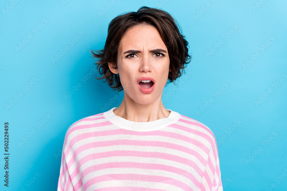 Fototapeta premium Portrait of young disappointed lady staring no believe impossible news grumpy face isolated on blue color background