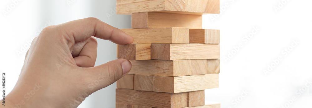 Planning to reduce investment risks, plan and strategy in business, Establishing a business risk mitigation plan to create stability for the company, Business growth with wooden blocks concept. Planning to reduce investment risks, plan and strategy in business, Establishing a business risk mitigation plan to create stability for the company, Business growth with wooden blocks concept.