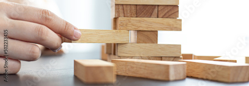 Planning to reduce investment risks, plan and strategy in business, Establishing a business risk mitigation plan to create stability for the company, Business growth with wooden blocks concept. photo