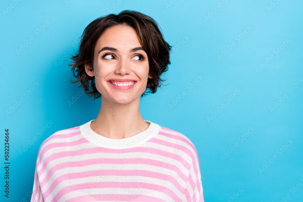 Portrait of charming lady look empty space decide buying fashion clothes in shopping center isolated on blue color background Portrait of charming lady look empty space decide buying fashion clothes in shopping center isolated on blue color background