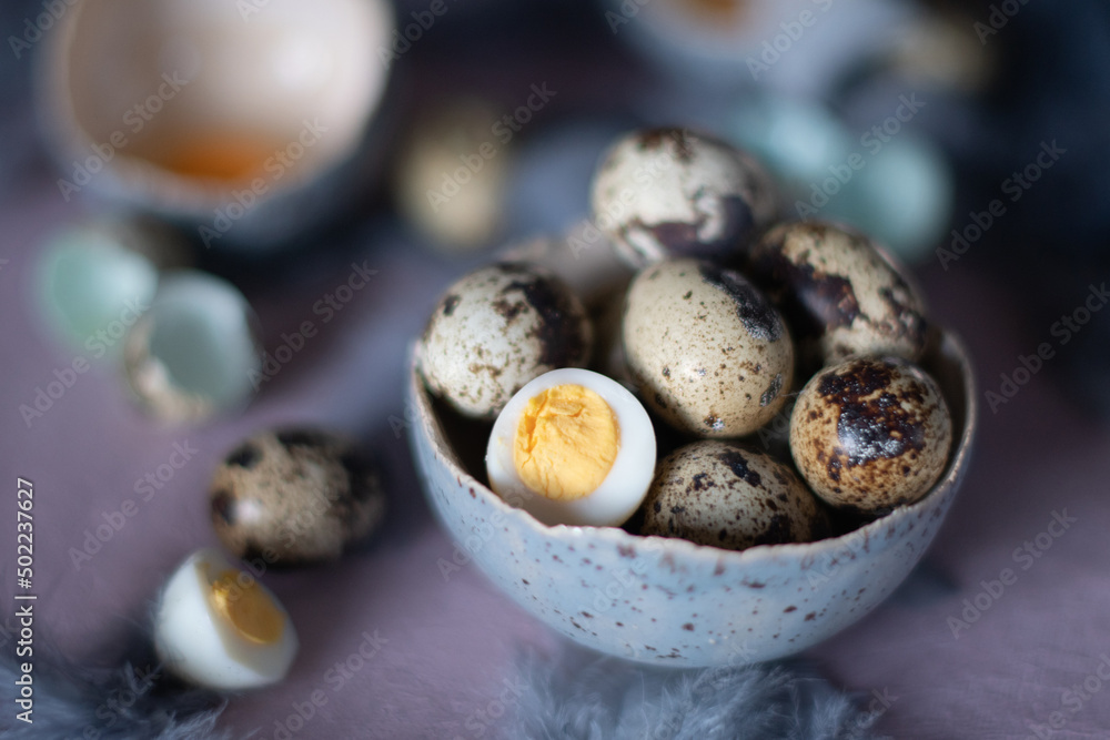 quail eggs in ceramic vases, gray feathers on the table, easter still life, quail eggs in ceramic vases, gray feathers on the table, easter still life,