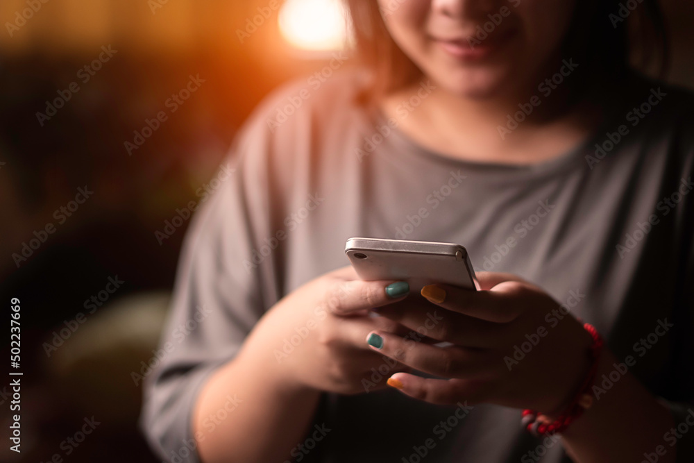 Happy woman using smart mobile phone, enjoys online communication, surfes social media,Social Distancing ,Working From Home Happy woman using smart mobile phone, enjoys online communication, surfes social media,Social Distancing ,Working From Home