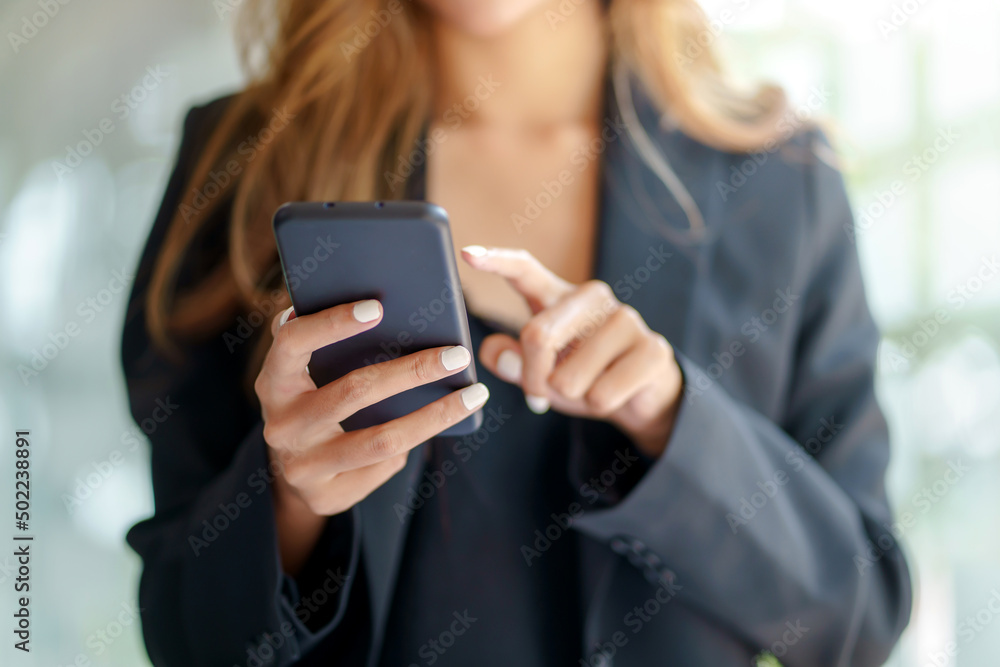 Woman using smartphone to send text , work or play social media. Woman using smartphone to send text , work or play social media.
