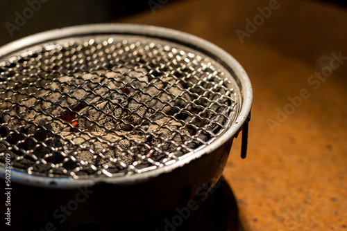 Empty grill with red-hot briquettes,empty grate © warongdech