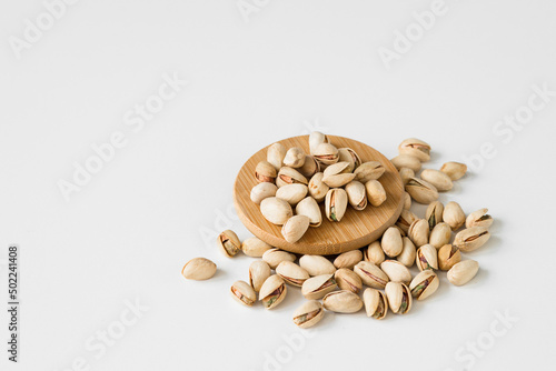 Heap of pistachios isolated on white background. Overhead