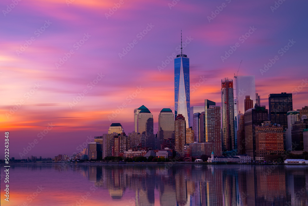 New York City Manhattan downtown skyline at dusk with skyscrapers over Hudson River, USA