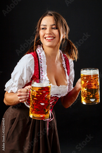 Oktoberfest server holding beer and smiling