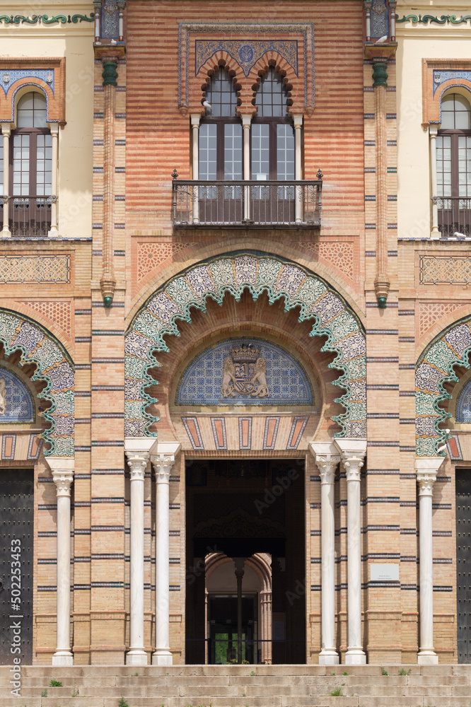 Exterior façade and main entrance of the museum of Popular Arts and Traditions in Seville (Andalusia, Spain). Building built by Anibal Gonzalez and called the Mudejar Pavilion.