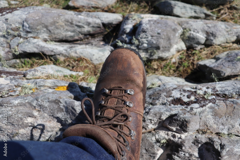 hiking boot on rocks hiking boot on rocks