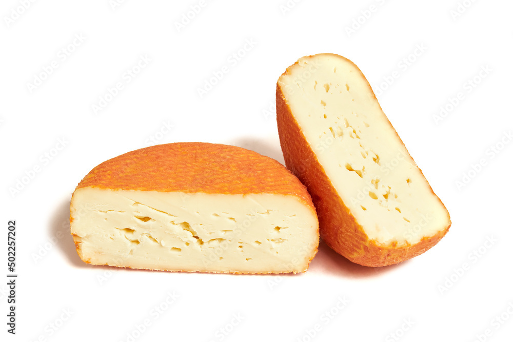 Piece of creamy red molded soft french cheese isolated on white background
