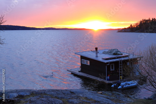Canvastavla Boathouse floating at a Swedish lake called Mälaren or Malaren