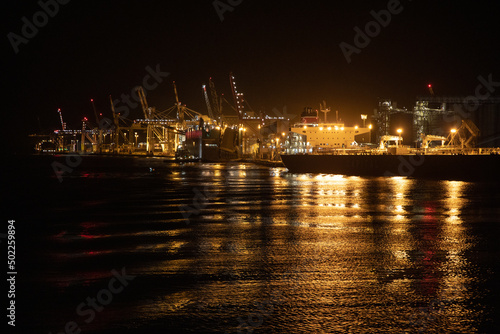 The industrial lighting emitted from The Port of Brisbane operating at night. photo