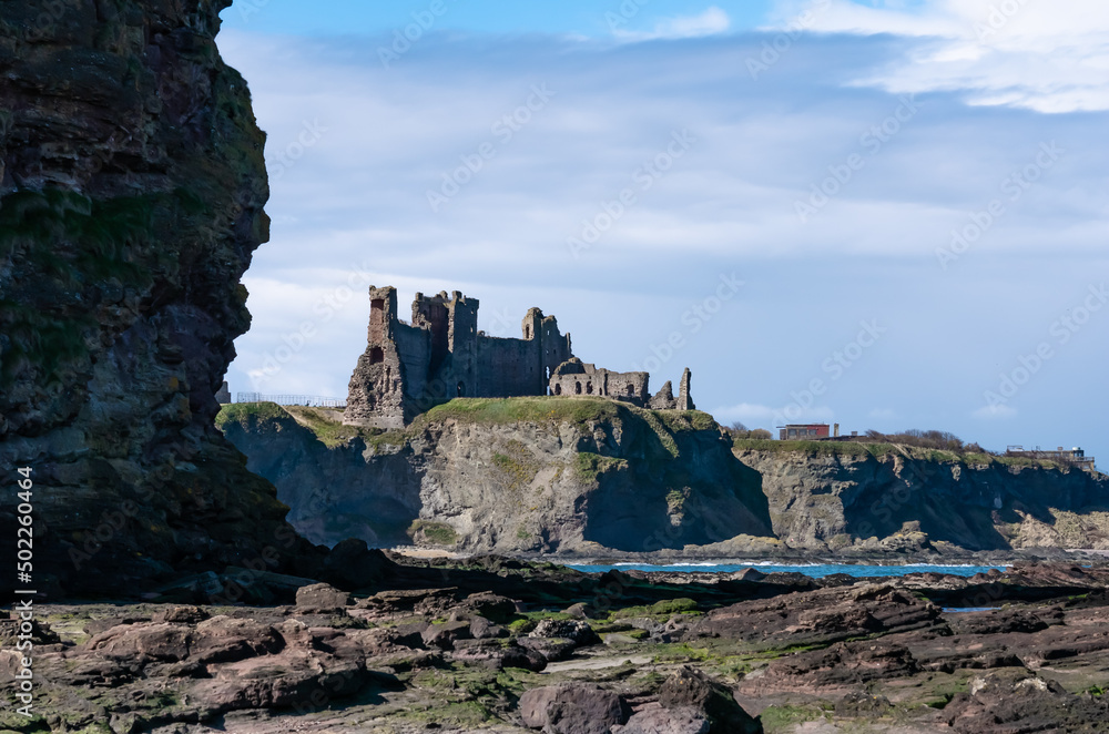 Tantallon Castle ruins standing tall on a cliff above sea on the Scottish Coast