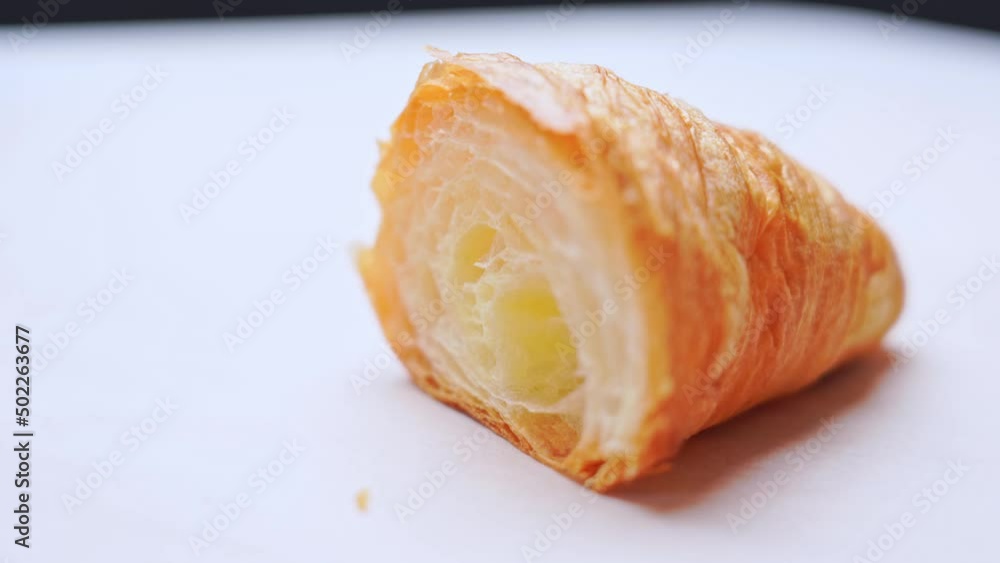 closeup of Cut freshly crispy croissant rotation for an appetizing breakfast. Homemade bakery ready to eat. closeup of Cut freshly crispy croissant rotation for an appetizing breakfast. Homemade bakery ready to eat.