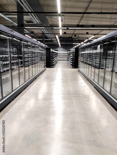 New shop equipment, refrigerators and freezers and shelves in a new supermarket