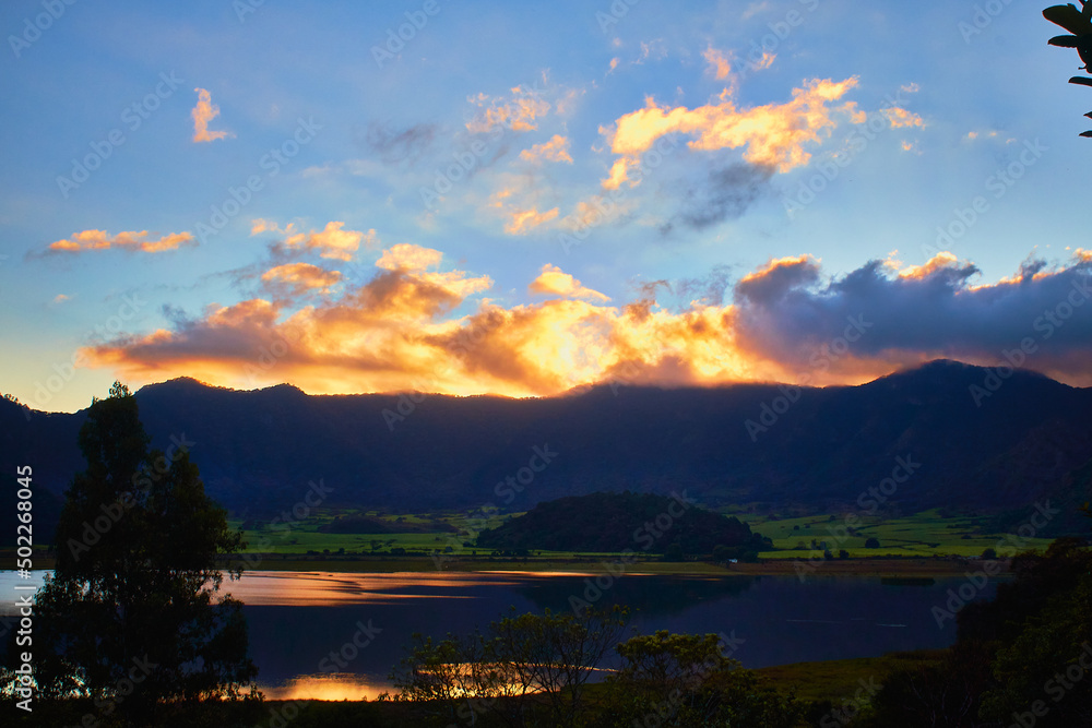 crater of volcano at sunset with beautiful lake in first plane in tepetiltic nayarit 