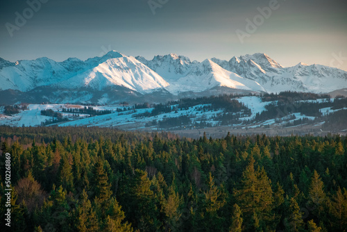 Snowy Tatra mountains in the rays of sunset.