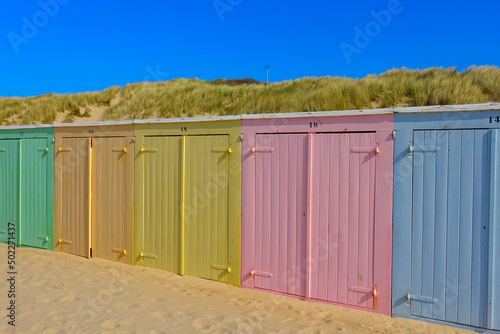 Little beach cabins at a North Sea photo