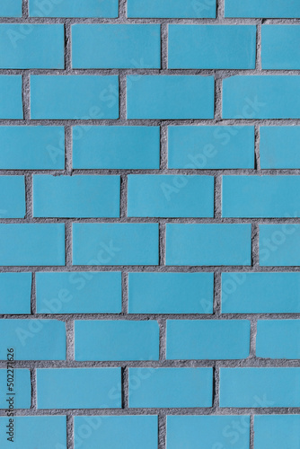Vertical photo of the texture of the blue colored old tiles for background