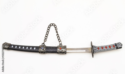 Souvenir dagger on a white background. Close-up