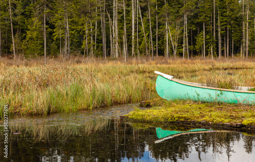 Beautiful landscape of a lake with boat in a forest. Whonnock Lake Provincial Park photo