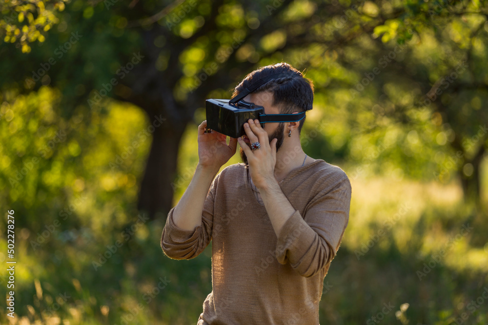man wearing virtual reality glasses outdoors man wearing virtual reality glasses outdoors