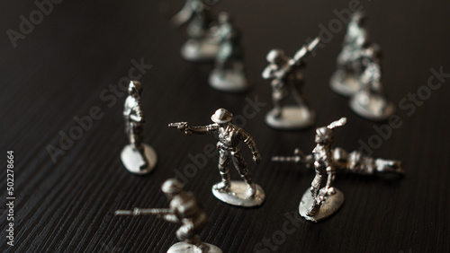 The concept of war and confrontation, political crises, toy tin soldiers attacking each other
