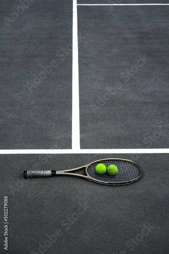 tennis racket and balls on the court close-up top view