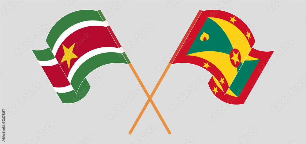 Crossed and waving flags of Suriname and Grenada Crossed and waving flags of Suriname and Grenada