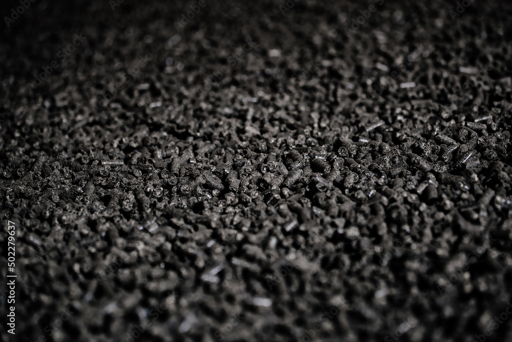 Black bio fuel pellets, close up view, selective focus Black bio fuel pellets, close up view, selective focus