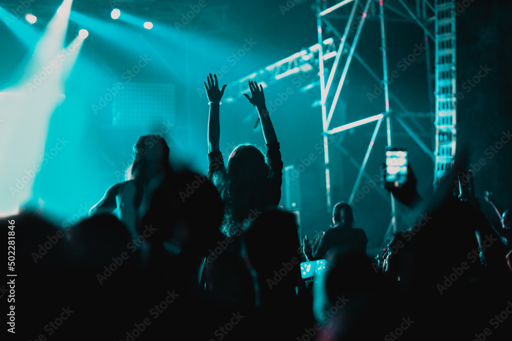 cheering crowd with raised hands at concert - music festival cheering crowd with raised hands at concert - music festival