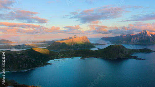 Sunset over blue fjords and mountains in Lofoten Norway