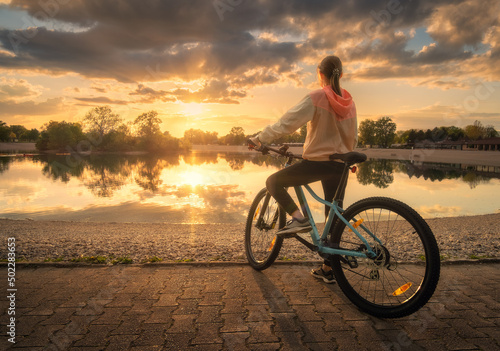 Woman riding a mountain bik...