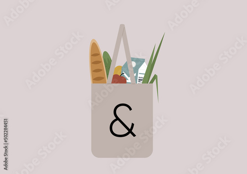 A shopping tote bag filled with farmers market groceries