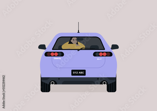 A young female Asian passenger seating on the backseat of a sedan car