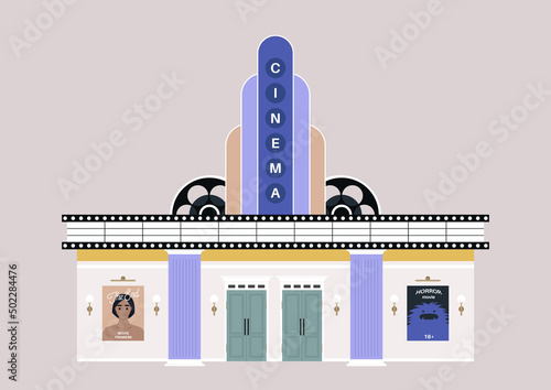 An old school cinema building entrance, movie posters and lights