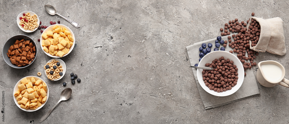 Different cereals and berries on grey background Different cereals and berries on grey background