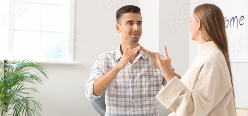 Young deaf mute couple usin...