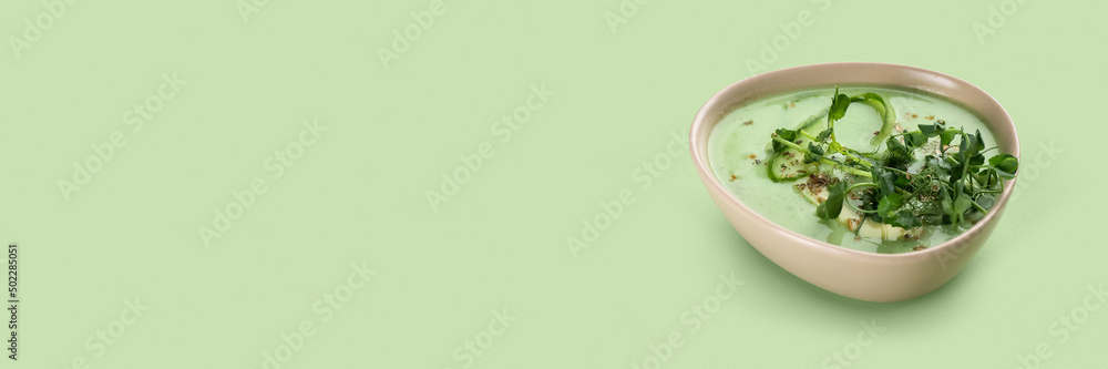 Bowl of tasty gazpacho on light green background with space for text Bowl of tasty gazpacho on light green background with space for text