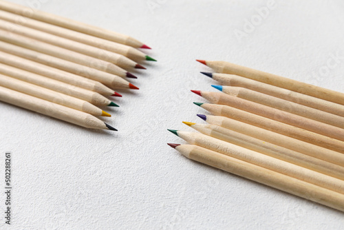 Colorful pencils on light b...