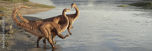 Plateosaurus couple, dinosaurs from the Late Triassic period walking on the beach  photo